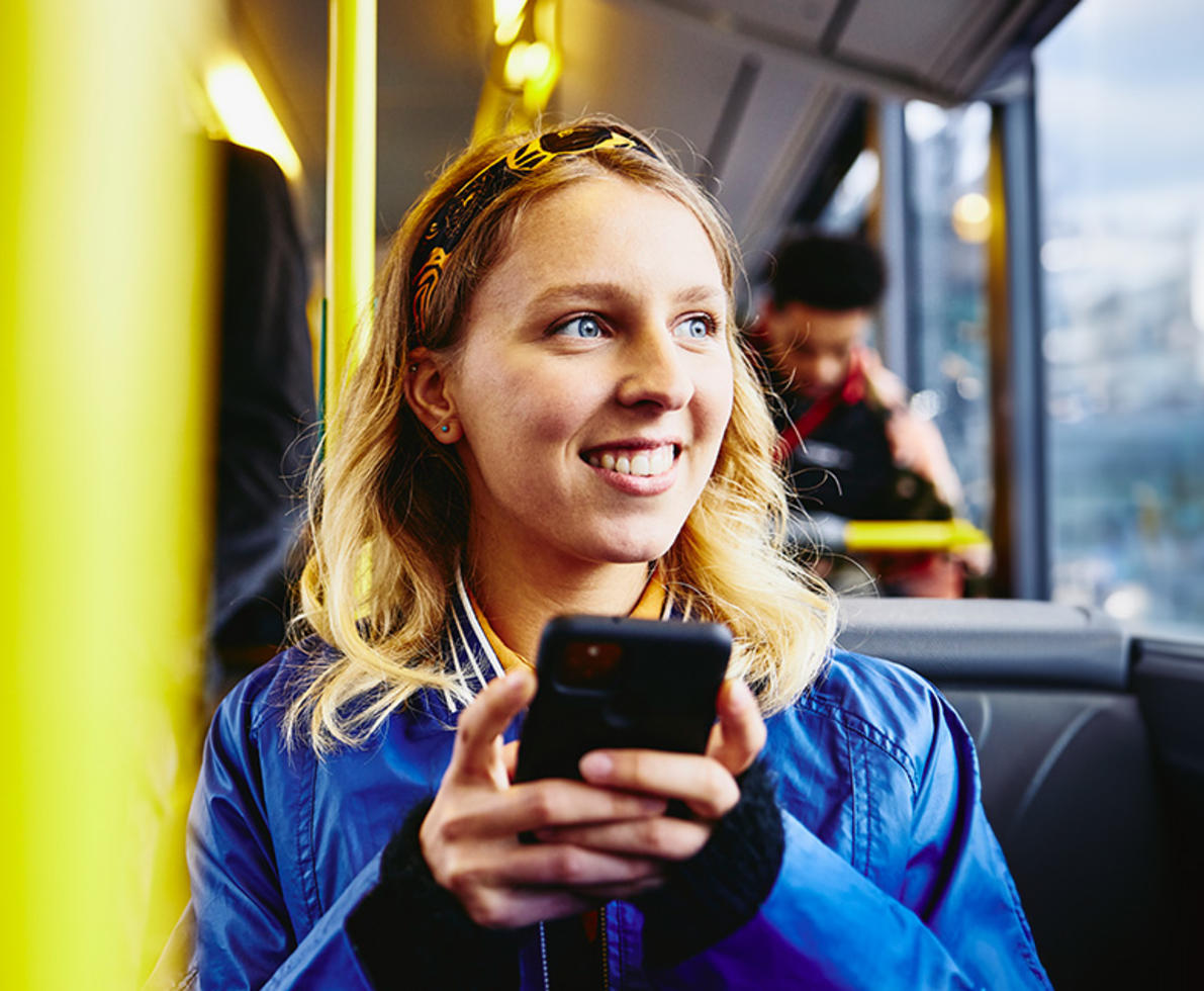 woman in bus on mobile